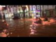 Canoes paddle through flooded Cork streets